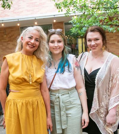 three people posing for photo