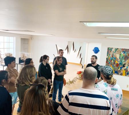 Image of University of Texas at Austin Art History class taking place in an artist's studio and immersed in Mexico City's art scene 