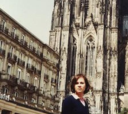 Woman standing in front of building in Copenhagen