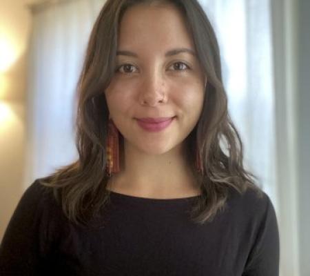 headshot of Zoe Fejeran wearing black shirt in front of a neutral background