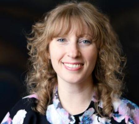 blond white woman with floral shirt portrait