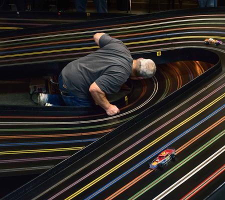 person in center of model car track