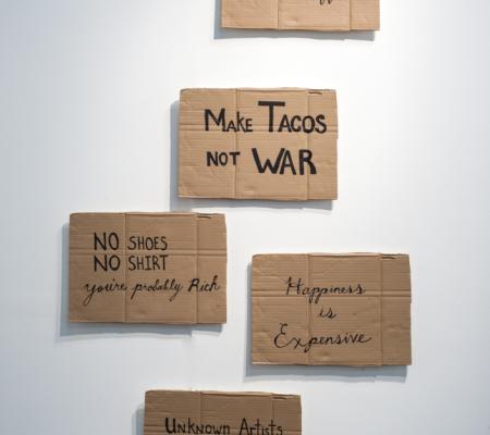 cardboard signs installed in a scattered column