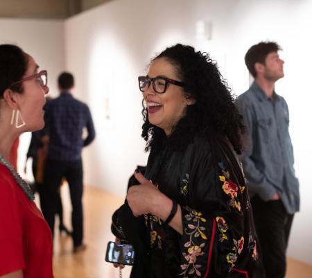image of curator Taylor Bradley and artist Elia Alba talking