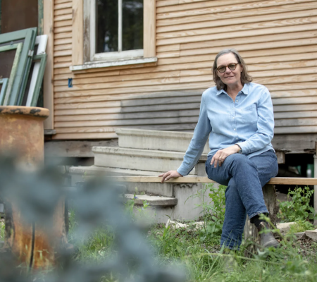 photo of Ethel Shipton sitting in a yard