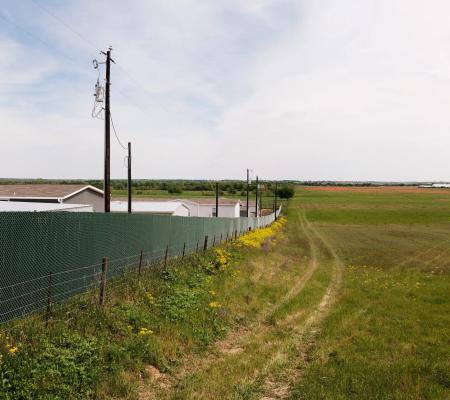 image of houses along a field