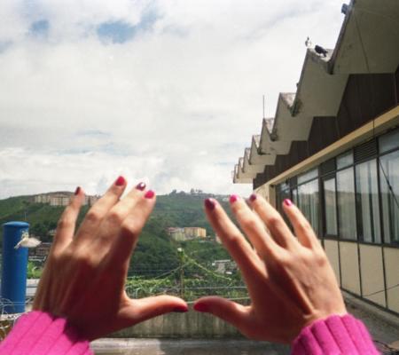 image of hands held up to the sky