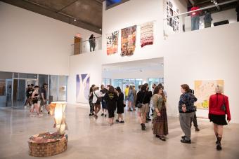 people in Visual Arts Center during exhibition opening