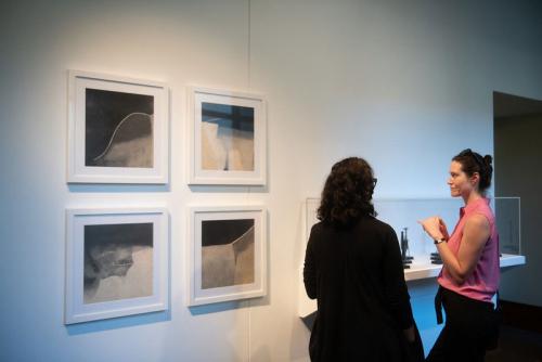 people looking at artwork in gallery