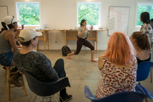 people in studio watching performance