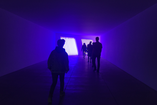 students in dark room with fluorescent lights